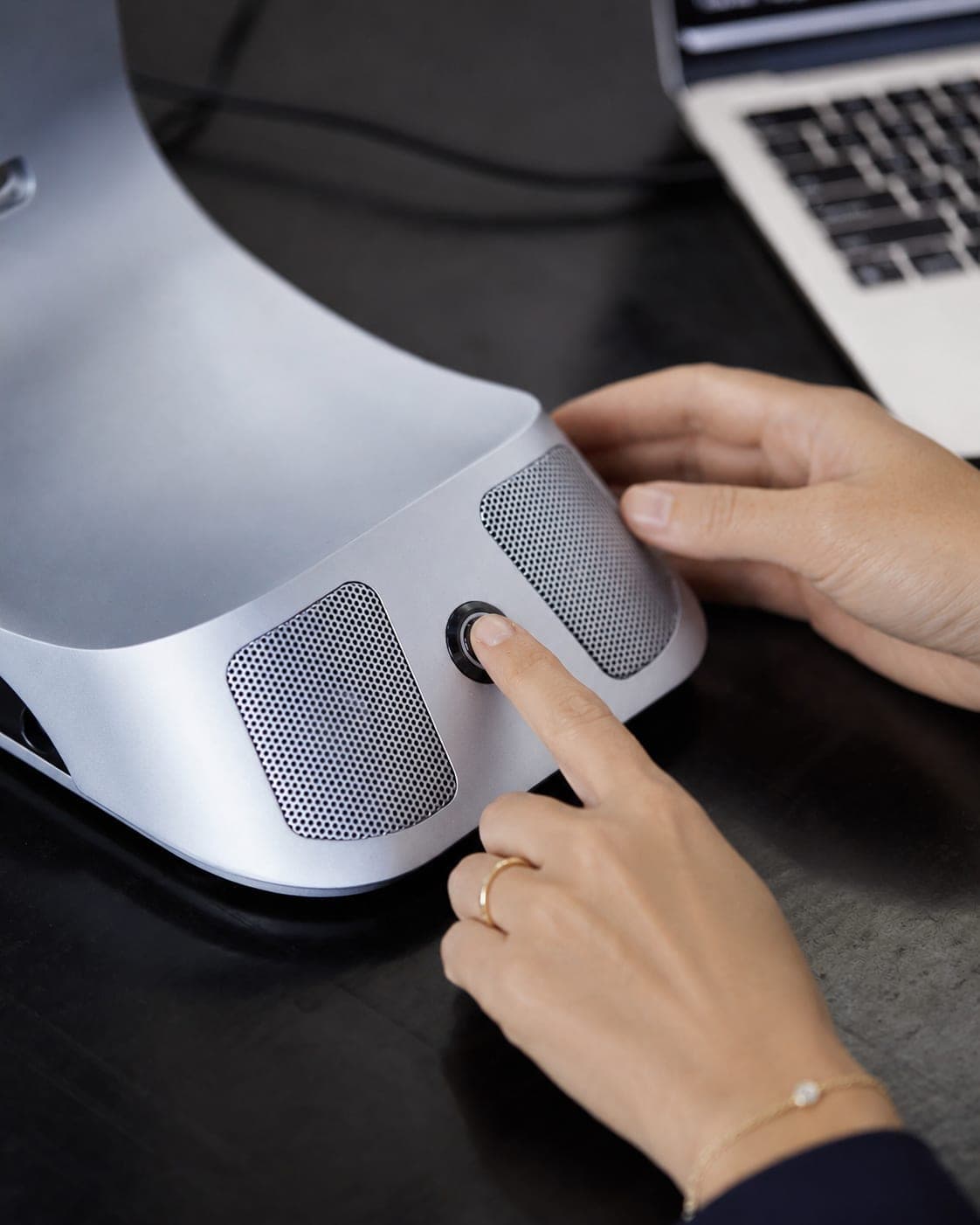 Pressing the power button on the iVi base with an index finger